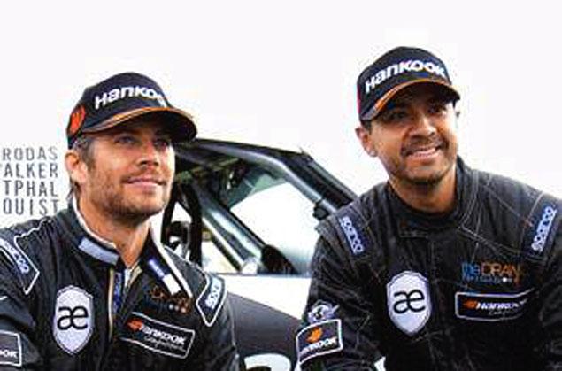 Paul Walker (left) seen with Roger Rodas, who has been identified as the other person who died in the car crash.